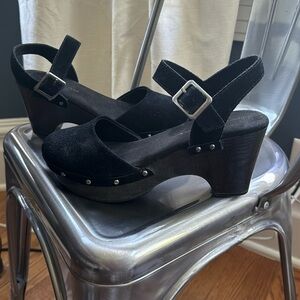 Size 8.5 Black House of Harlow 1960 Black Suede clogs with strap around ankle.